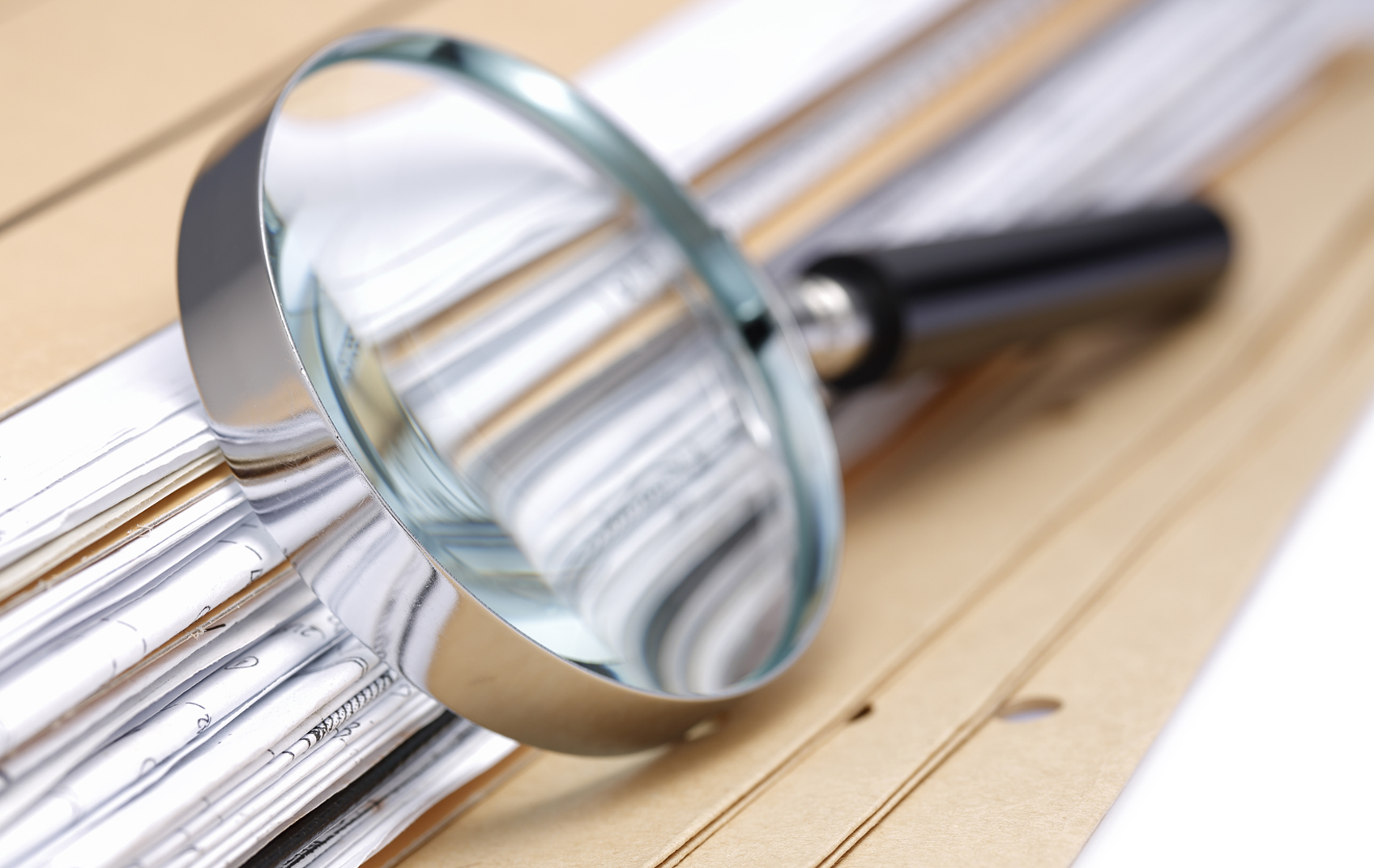 Magnifying glass on reports - Glenn Rowe Impact