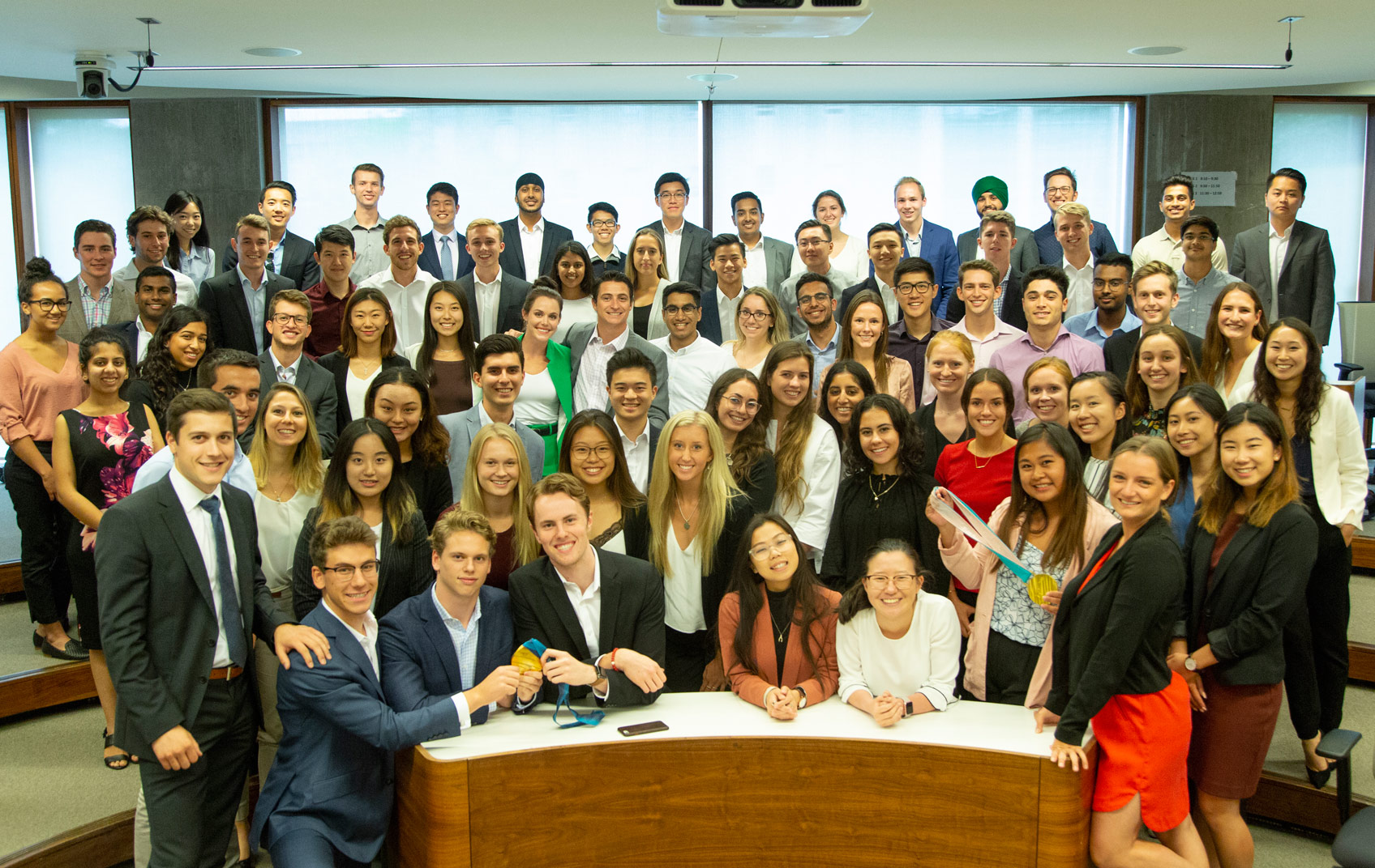 Scott and Tessa with some students in an Ivey classroom