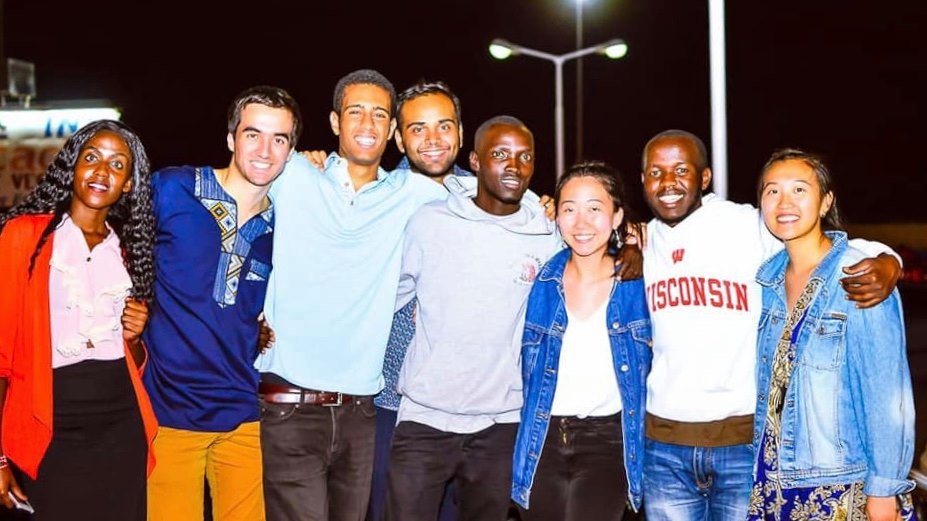 Students posing together at night