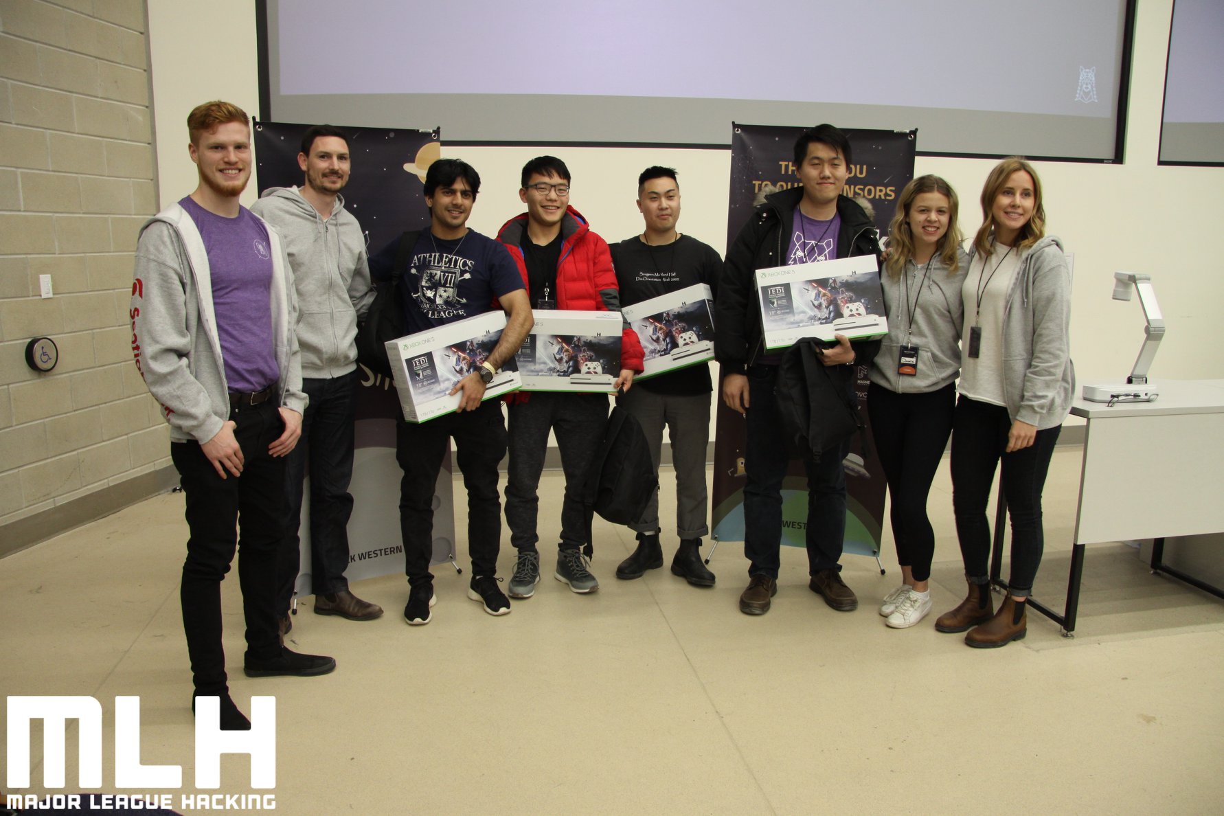 Representatives from Scotiabank pose with members of change4change, winners of Best FinTech Hack.