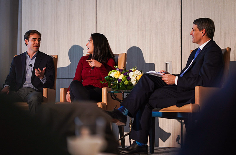 Tyler Shultz and Erika Cheung speaking at an event with Jon Hantho