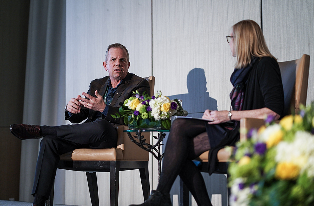 Stephen Virgin speaking at an event with Mary Crossan