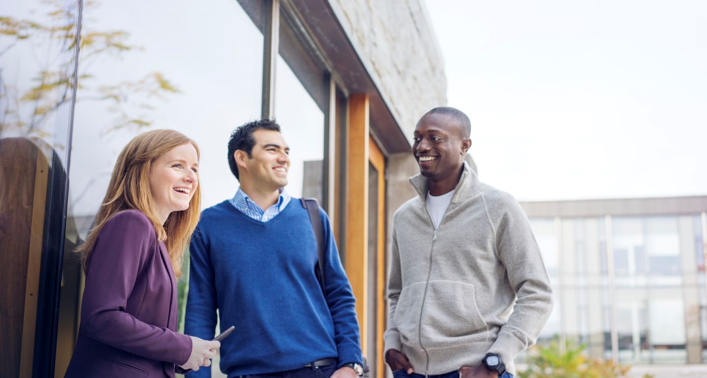 Group of students standing in the Ivey courtyard