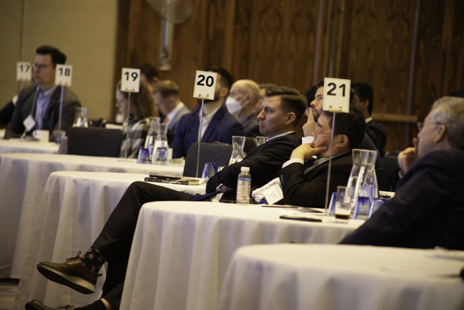 Audience members listening to panel 2