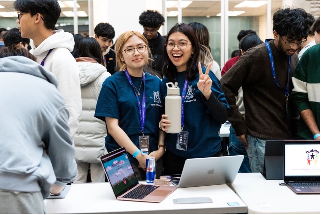 Hackathon team presenting their project at Hack Western 10