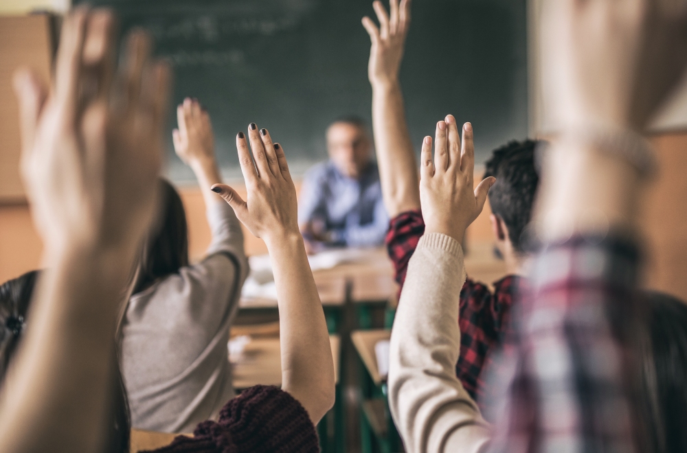 Students raising their hands