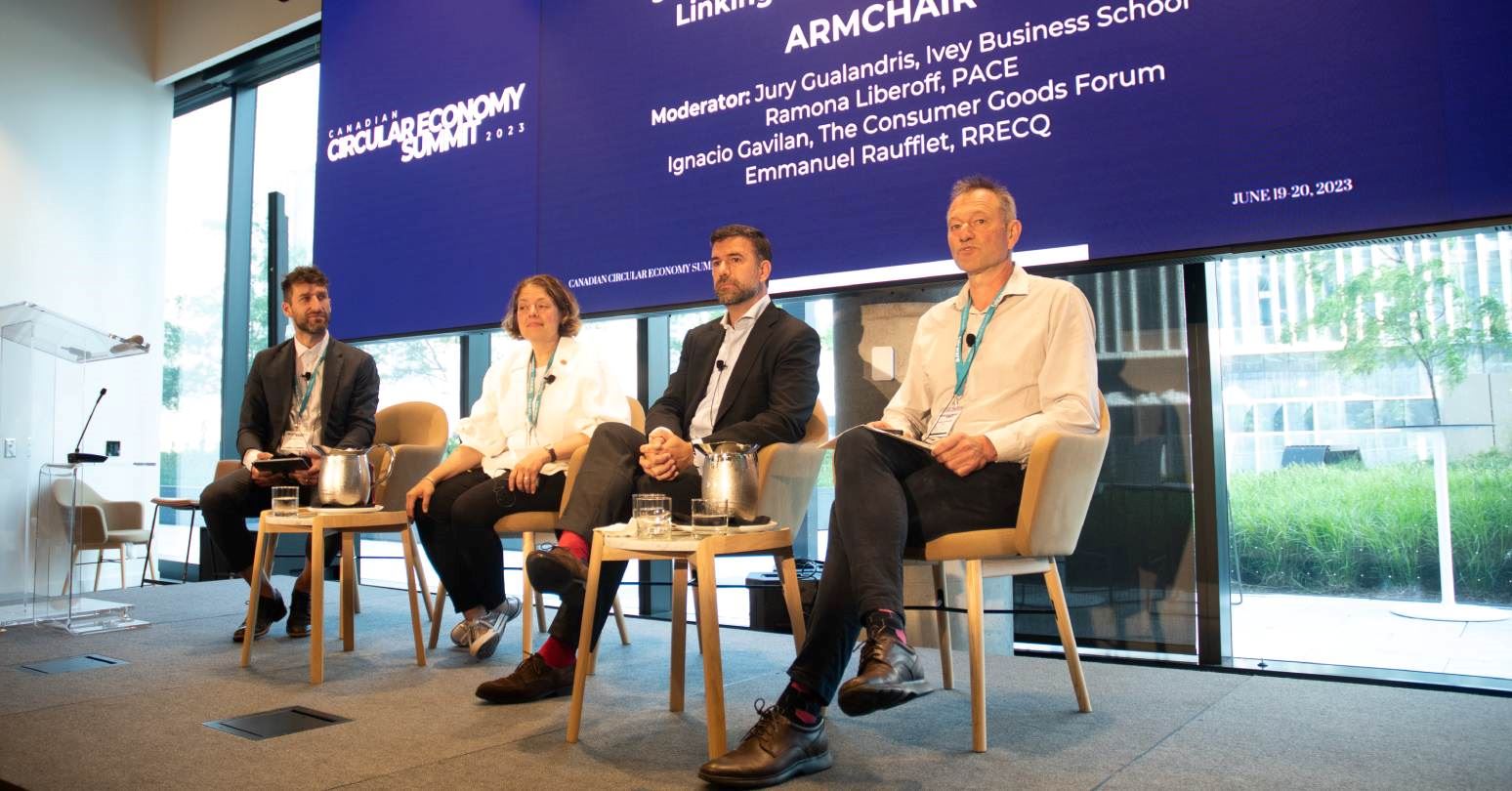 Jury Gualandris and others sitting in chairs on a panel